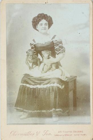 Female performer with two monkeys