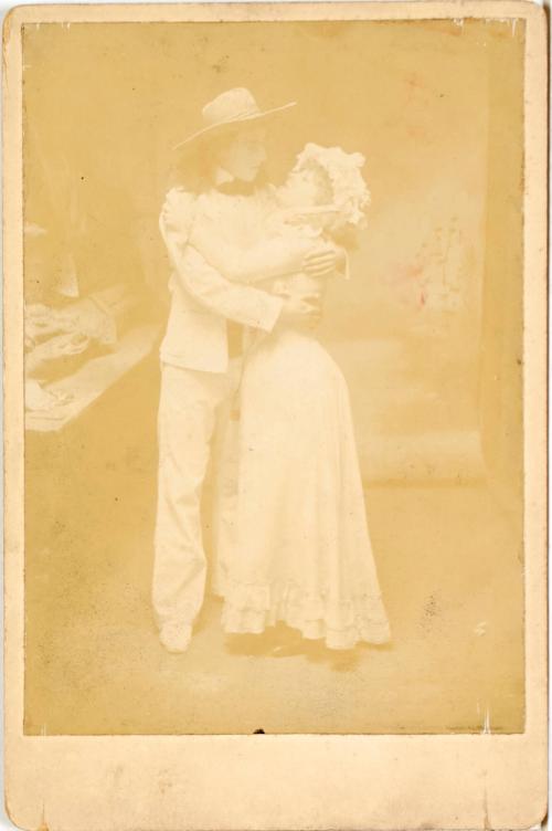 Cowboy embracing a girl