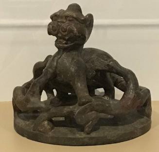 Stone lid with striding Chimera and encircling, sinuous creatures