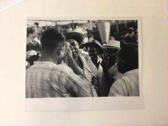 Group of Haitian men talking 