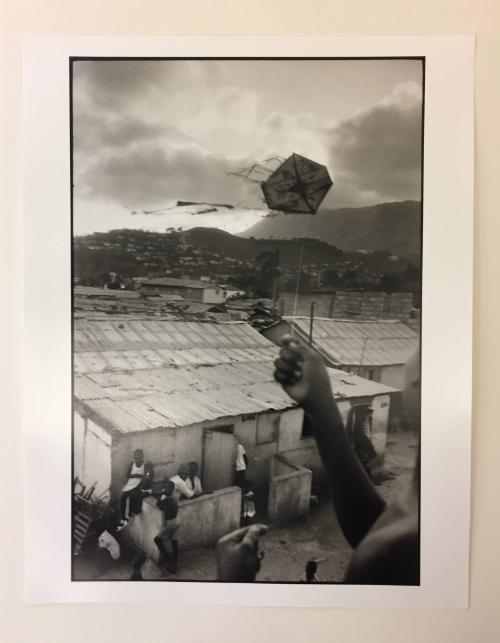 Cap Haitian (hand holding flag waving in the wind)
