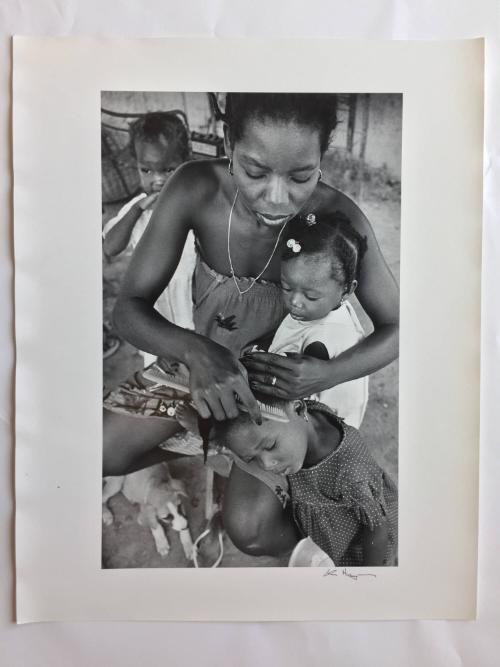 Mother combing daughter’s hair, Haiti