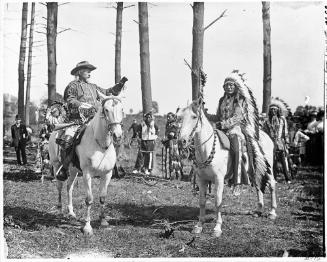 Portrait of William "Buffalo Bill" Cody and Chief Iron Tail on Horseback