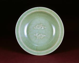 Dish with molded design of carp under celadon glaze