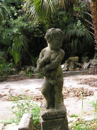 Putto holding fruit, looking left