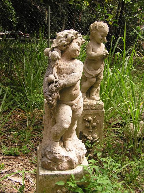 Putto with branch of fruit on right