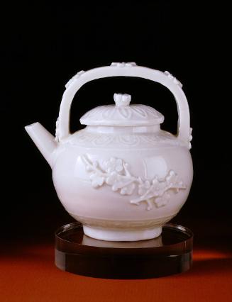 Tea or wine pot and lid (with molded prunus decoration)