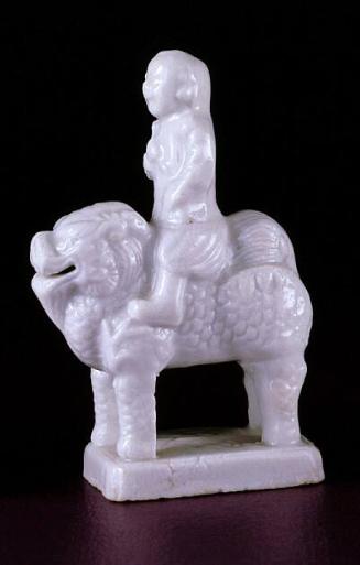 Miniature figure of European on creature