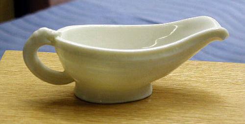 Dish with looped handle