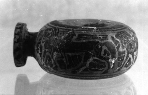 Ring-shaped oil flask (aryballos) with three horses with riders