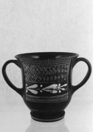 Two-handled drinking cup (kantharos) of Saint-Valentin type with textile-like fringed panels of laurel leaves and diamonds