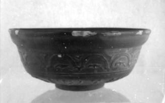 Red Slip bowl with relief decoration of birds, dolphins in waves, and figures of Eros with (wine?) vessels