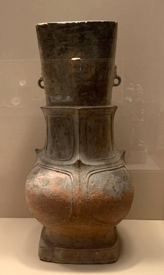 Ritual wine vessel decorated with panels and protruding handles and rings