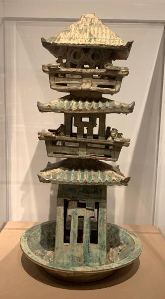 Model of a watch tower in a basin