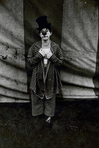 Jill Freedman (American, 1939 – 2019)
Clown standing in front of tent wall (Circus Days), c. 1…