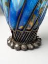 Base of vase showing wrought iron details