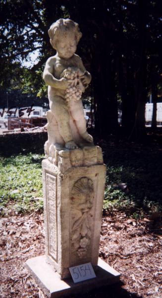 Putto looking at bunch of grapes