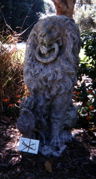 Lion holding ring in mouth