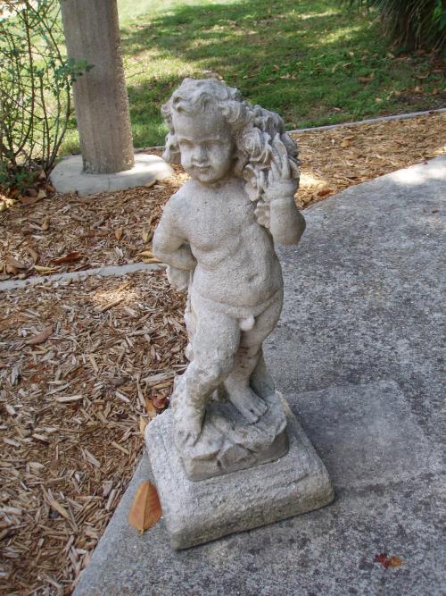 Putto with flowers on left shoulder