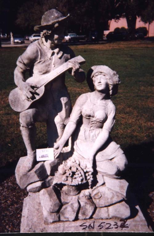 Male with guitar and Female Statue