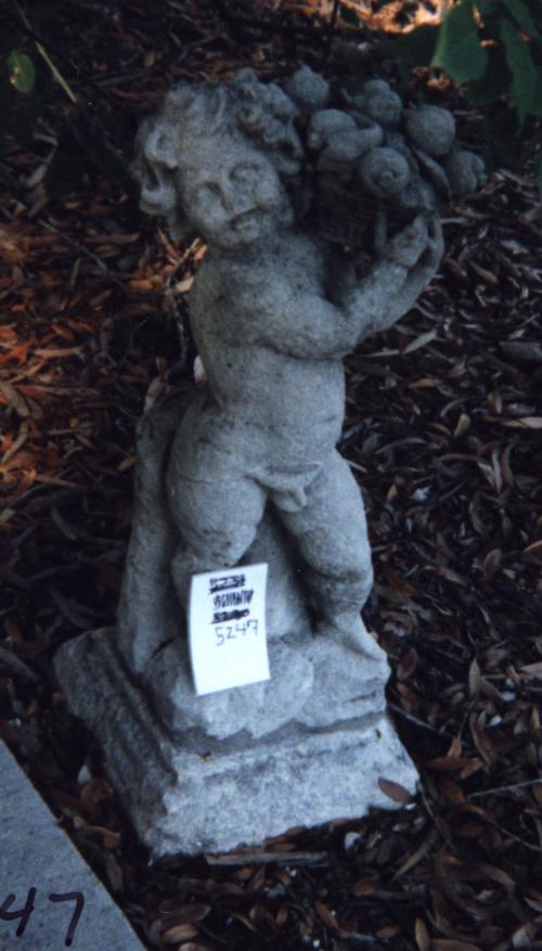 Putto holding fruit on left shoulder with both hands