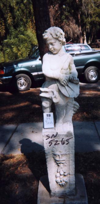 Putto holding drawing compass and plans