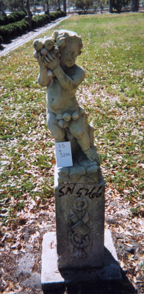 Putto holding fruit to right of head