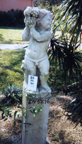Putto holding grapes up high next to right of head