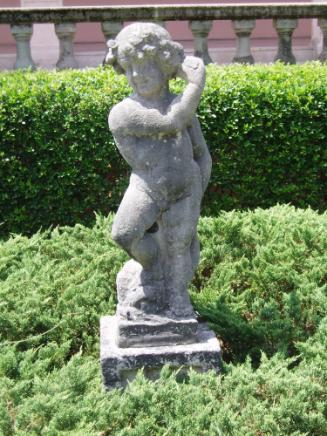 Putto holding something up to left ear