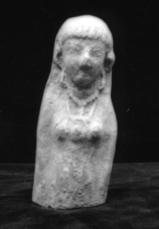 Female figurine wearing earrings, a necklace, and a disc-shaped pendant