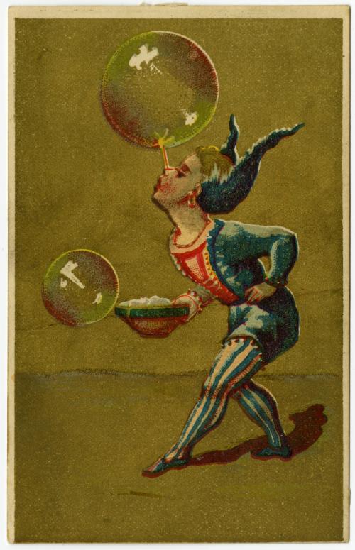 Clown balancing bubble on nose
