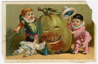 Three children carving face into fruit