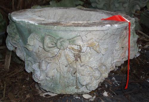 Urn decorated with Lion heads and bows
