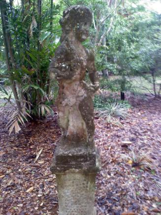 Striding Dwarf/Putto with flowers