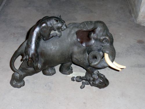 Elephant attacked by two tigers