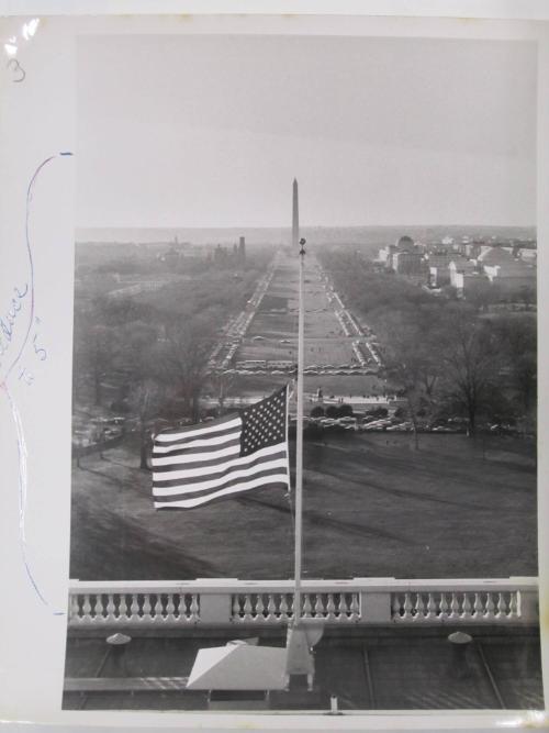The Mall Beyond a United States Flag Flying at Half Mast on the U.S. Capitol Building