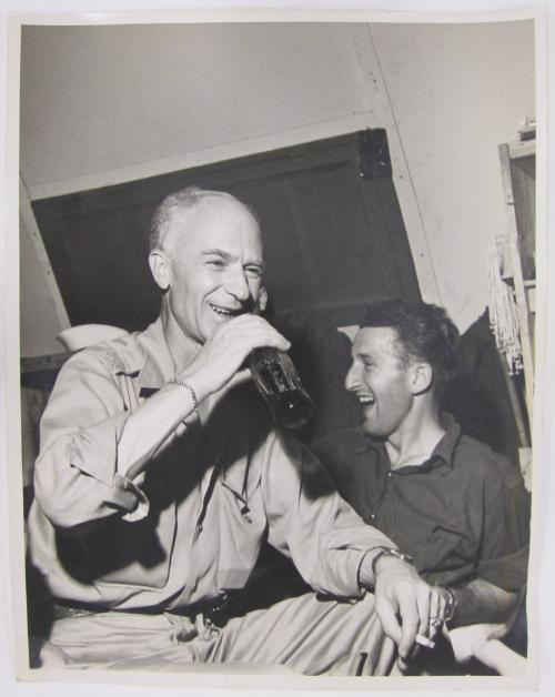 Ernie Taylor Pyle Sits Enjoying a Coca Cola and Smoking a Cigarette
