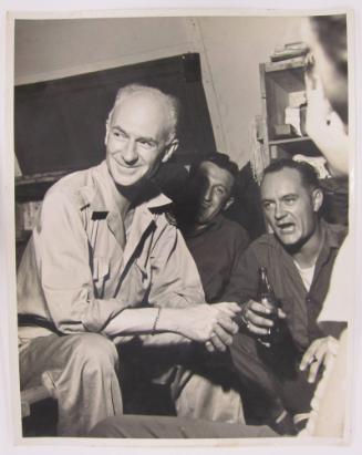 Ernie Taylor Pyle Sits and Smiles in a Social Group
