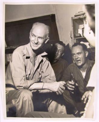 Ernie Taylor Pyle Sits and Smiles in a Social Group
