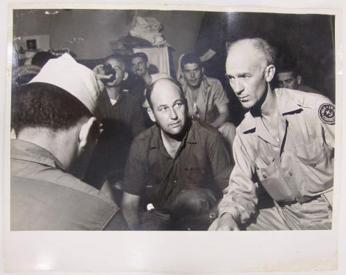 Ernie Taylor Pyle Sits Seriously in a Group
