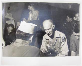 Ernie Taylor Pyle Sits with Serious Expression