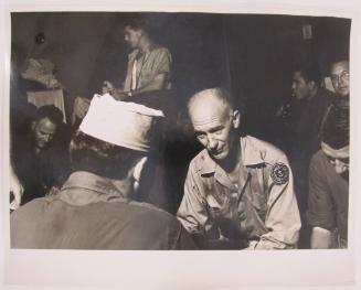 Ernie Taylor Pyle Sits with Serious Expression