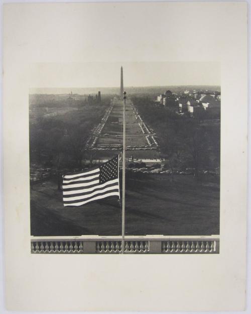 The Mall Beyond a United States Flag Flying at Half Mast on the U.S. Capitol Building