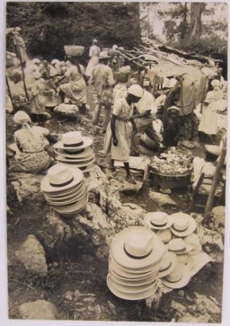 Men's Hats Stacked in a Market Place