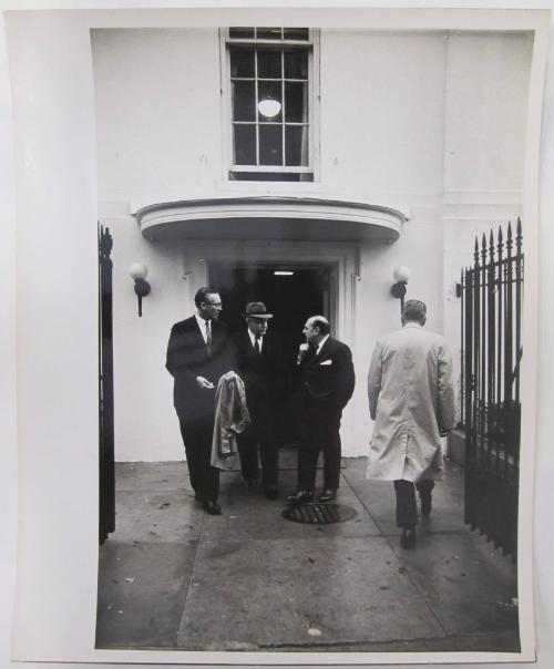 Men Conferring by The White House Entrance
