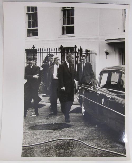 Lyndon Johnson with a Group of Men Behind White House