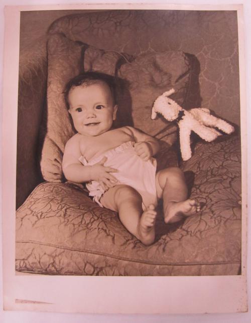 Smiling Baby with Stuffed Animal