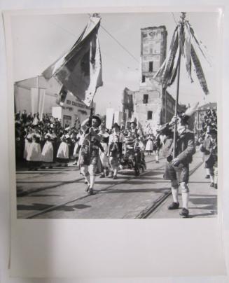 Men in Lederhosen Dance on Railway Tracks