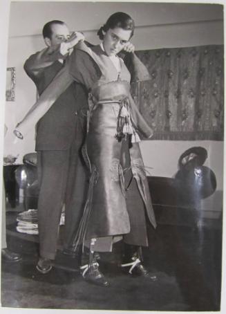 Conchita Cintron Being Dressed