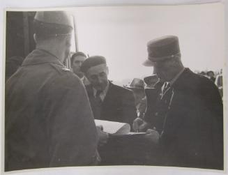 Men Sign Document